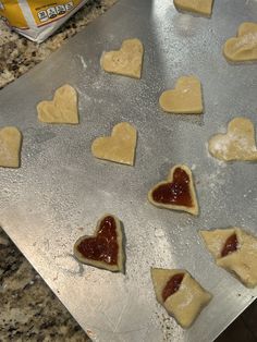 heart shaped cookies on a cookie sheet ready to be baked