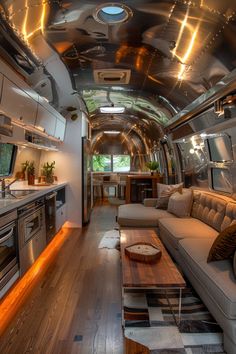 the interior of an airstream with couches and tables