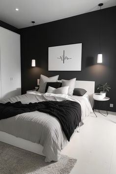 a bedroom with black walls and white bedding