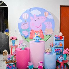 peppa pig birthday party decorations including cake and cupcakes