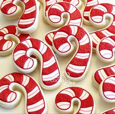 red and white decorated cookies with swirl designs