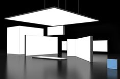 an empty room with several square and rectangular lights