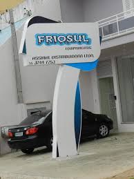 a car parked in front of a building with a sign that says frosul