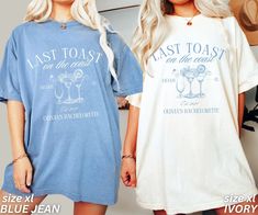 two women standing next to each other wearing matching t - shirts and shorts with the words last toast on them