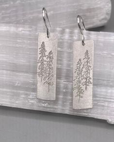 "Large sterling silver Tall Pine Earrings etched with Lodge Pole Pines. The earrings dangle from sterling silver French wires and measure 1 1/8\" x 3/8\"." Birthday Money, Mountain Necklace, Elk Antlers, Grand Lake, Better Style, French Wire, Earrings Dangle, Bar Necklace, Funny Design