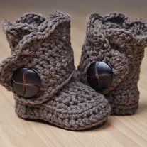 a pair of crocheted baby booties is shown on the pinterest app