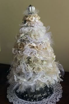 a white christmas tree on top of a table