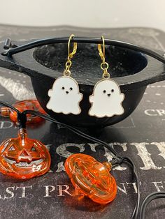 Halloween Earrings featuring little enamel pastel colored ghosts! These earrings are so cute and perfect for spooky season. Only available in gold. These cute little earrings are sure to make a statement and are the perfect fall accessory. Fall Goodies, Pastel Jewelry, Crystal Keychain, Little Earrings, Ghost Earrings, Witch Jewelry, Earrings Halloween, Cute Letters, Fall Earrings