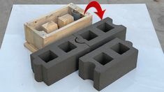 an object made out of cinder blocks with a red arrow pointing to the block that is in