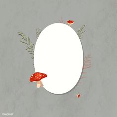 an oval frame with mushrooms and plants around it on a gray background for text or image