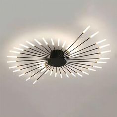 a circular light fixture with many lights on it