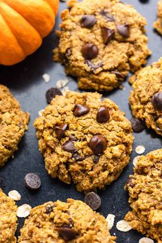 cookies with chocolate chips and pumpkins in the background