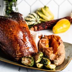 a roasted turkey and brussel sprouts on a plate