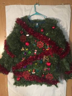 a christmas sweater hanging on a clothes hanger