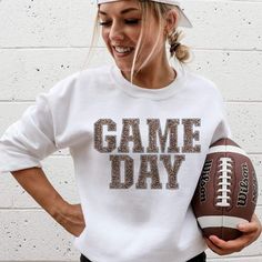 Model is wearing a white sweatshirt featuring a leopard print graphic that says Game day Charlie 1 Horse Hat, Sublimacion Ideas, Cute Game, Leopard Print Sweatshirt, Print Fonts, Spirit Wear, Black Fleece, Print Sweatshirt, Comfy Fits