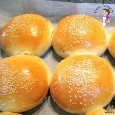 several buns with sesame seeds on them