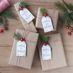 four wrapped presents tied with twine and christmas decorations