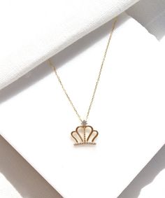 14K Gold Queen Crown Necklace A small dainty crown hanging on a simple solid gold chain. This is a unique piece for celebrating yourself or your loved ones. It is perfect for everyday wear as it made of solid gold and won't tarnish. We promise that this necklace will be a piece you cherish forever. Features: * This necklace is made of patented 14K solid gold. * Standard length of gold necklaces are 42cm. For special lengths please contact us. Packaging: You will get your jewelry in a beautiful p Gold Plated Diamond Necklace With Adjustable Chain For Wedding, Wedding Gold Plated Diamond Necklace With Adjustable Chain, Regal Gold Necklaces For Wedding, Gold Sterling Silver Bridal Necklace Gift, Gold Regal Necklace For Wedding, Regal Gold Necklace For Wedding, Regal Gold Necklace For Gift, Teardrop Crown Jewelry With Diamond Accents For Gift, Elegant Gold Jewelry With Crown Design