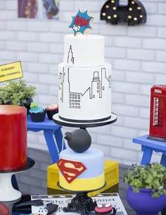 there is a cake on top of a table with other decorations and decorating items around it