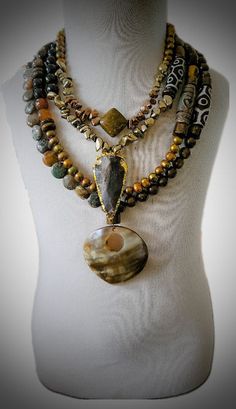 Rainforest Jasper and Freshwater PEARL Layered Necklace This Jasper and Pear Multi-layered Necklace is made with many different gemstones! Rainforest jasper, colored freshwater pearls, agate, bronzite, tiger eye, hematite, tibetan agate, and smoky quartz. All to give you the natural brown effect. Pendants are Jasper arrowhead, and an authentic jasper stone. The quality of this necklace is magnificent ! It is heavy ( Bohemian Ocean Jasper Gemstone Beads Jewelry, Bohemian Jewelry With Ocean Jasper Gemstone Beads, Earthy Ocean Jasper Jewelry With Natural Stones, Earthy Moss Agate Jewelry With Natural Stones, Bohemian Moss Agate Jewelry With Gemstone Beads, Bohemian Gold Jewelry With Moss Agate, Artisan Jewelry With Ocean Jasper Gemstone Beads, Earthy Jasper Gemstone Beads Jewelry, Nature-inspired Brown Jewelry With Gemstone Beads