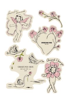 some stickers that are on the side of a white board with pink flowers and angels