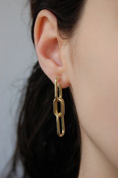 These gold hoop earrings are made with 18 karat gold plating. This gold plating protects against wear and tear, tarnishing, and light contact with substances such as water. Closures: * Standard closures are hypoallergenic and nickel free. (For pierced ears) * Clip on closures are made of acrylic/plastic which makes for an invisible look. They are also hypoallergenic and nickel free. (For nonpierced ears) How to wear clip ons: Hold the front of earring in one hand while pulling the clear closure Minimalist Paperclip Chain Dangle Earrings, Dangle Earrings With Paperclip Chain, Gold Drop Earrings With Paperclip Chain, Modern Chain Link Earrings For Gift, Modern Chain Link Earrings As Gift, Trendy Paperclip-shaped Earrings As Gift, Trendy Chain Link Earrings As Gift, Trendy Chain Link Earrings For Gift, Trendy Paperclip Earrings As Gift