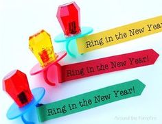 three different colored magnets on top of each other with the words ring in the new year