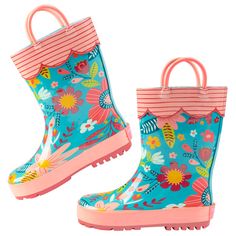 a pair of children's rain boots with flowers on them