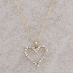 This ladies 14k yellow gold necklace has a heart shaped diamond pendant that measures 19 mm in height, including the bail, and 16 mm in length. The necklace together weighs 1.48 grams and the fine rope chain has a small spring ring clasp. There are twenty-six round brilliant diamonds that are single prong set and measure 0.38ctw.  Condition: New *All items are thoroughly inspected for quality assurance purposes Classic Gold Diamond Necklace With Heart Charm, Gold Heart-shaped Brilliant Cut Diamond Necklace, Yellow Gold Heart Pendant Necklace With Diamonds, Gold Heart Pendant Necklace With Brilliant Cut, Yellow Gold Diamond Necklace With Heart Charm And Cut, 14k Gold Open Heart Necklace With Diamond Accents, Yellow Gold Diamond Necklace With Heart Cut And Charm, Yellow Gold Diamond Necklace With Heart Charm, Yellow Gold Open Heart Necklace With Brilliant Cut