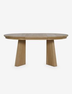 an oval wooden table with two legs and a circular shaped top, against a white background