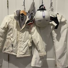 Little Girls Ski Outfit. North Face Jacket Hyvent 550 Down Size 7/8. Some Yellowish Discoloration. Jacket In Good But Used Condition. Karbon Ski Pants. Size8. In Excellent Condition. Bolle Helmet And Goggles. Some Stain On Helmet. North Face Ski Outfit, White The North Face Outerwear For Outdoor Activities, White Ski Pants Outfit, White Outerwear For Snowboarding And Ski Season, Ski Pants Outfit, White Snow Jacket, Ski Clothes Women, White Sporty Outerwear By The North Face, Sporty White The North Face Outerwear