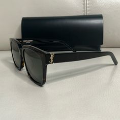 Dark Tortoise Frame With Grey Lenses, Embellished With Ysl Logo At Each Temple. Frame Shape And Size Is Easy To Wear For Most. 55-16-145 Ysl Sunglasses Women, Ysl Sunglasses, Saint Laurent Accessories, Saint Laurent Sunglasses, Ysl Logo, Grey Lenses, Colored Sunglasses, Tortoise, Sunglasses Accessories