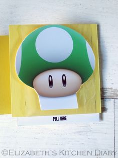 a close up of a mushroom on top of a piece of paper with the words pull mee