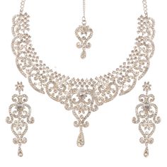 PRICES MAY VARY. New! Touchstone Indian Bollywood Princess Diana Studded Diamond Look Scintillating White Rhinestone Designer Jewelry Necklace Mangtika Set In Silver Tone For Women. Extra Long Earrings: Length 3 Inches. SPECIFICATIONS : Necklace circumference 15 inches extendable chain/links upto 20 inches. Earring weight (single) 18 gms. Earring length 3 inches . Earring width 1.50 inches. OCCASION Will add luster when worn for a wedding, engagement, party, prom and any special occasion. Will e Bridal Maang Tikka, Indian Jewelry Set, Extra Long Earrings, Jewellery Wedding, Fancy Costumes, Maang Tikka, Gold Wedding Jewelry, Indian Jewelry Sets, Necklace Sets