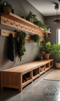 a wooden bench sitting next to a window filled with potted plants on top of shelves