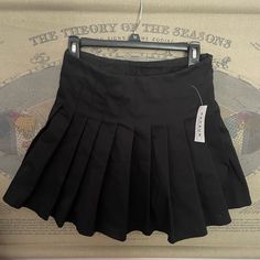 Brandy Melville Tennis Skirt Thick Material With Black Shorts Attached Black Pleated Tennis Skirt For Summer, Black Mini Tennis Skirt For Spring, Black Pleated Mini Tennis Skirt, Summer Black Pleated Skort, Black Mini Skirt For School Uniform, Trendy Black Pleated Tennis Skirt, Black High-waist Cotton Pleated Skirt, Black Pleated Skort For Summer, Trendy Black Cotton Pleated Skirt