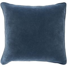 a dark blue pillow on a white background