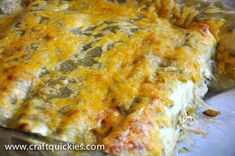 a cheesy casserole dish with meat and cheese on it, ready to be eaten