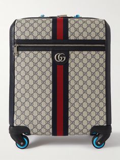 If you want to travel like the jet-set, a Gucci suitcase is the obvious choice. This 'Savoy' trolley is made from monogrammed coated-canvas, reinforced with full-grain leather trims and fitted with a convenient telescopic handle. It opens to a spacious interior with space enough for your in-flight essentials and a few outfits when you land. Designer Luggage With Sleeve For Trip, Luxury Travel Cases, Designer Travel Cases With Luggage Sleeve, Luxury Cases With Luggage Sleeve For Trips, Luxury Travel Cases With Luggage Sleeve, Designer Luggage For Trips, Luxury Rectangular Cases For Trip, Luxury Rectangular Travel Cases, Gucci Suitcase