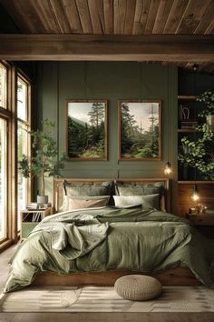 a bedroom with green walls and wooden floors, two pictures on the wall above the bed