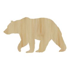 a wooden cutout of a bear on a white background