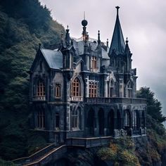 an old castle like building on top of a cliff