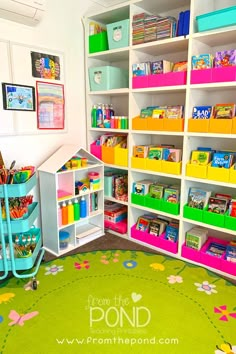 a child's playroom with lots of toys and bookshelves in it