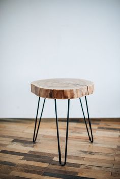 a wooden table sitting on top of a hard wood floor