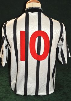 a black and white striped shirt with the number 10 on it's chest,