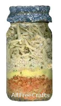 a jar filled with lots of different types of pasta in it's bottom half