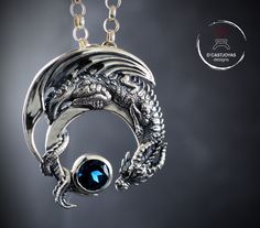 ** Dragon pendant in solid sterling silver and natural London blue topaz. Crescent dragon ** This beautiful pendant was born after working on the seventh season of the Game of Thrones series. Surrounded by stunning dragon designs, I decided to pay tribute to them and create my beautiful Drogon pendant. Made in sterling silver with a precious stone, in this case a spectacular London blue topaz. SYMBOLOGY ** I've always been fascinated by dragons. This strange creature has always been present in t Moon Dragon, Polymer Clay Dragon, Gold Skull, Dragon Necklace, Dragon Jewelry, Silver Dragon, Skull Jewelry, Dragon Pendant, Oxidised Jewellery