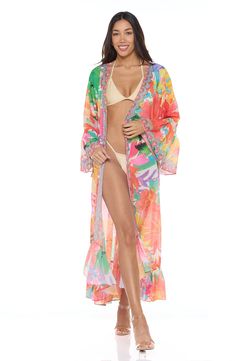 A vibrant tropical-inspired pattern enlivens this vacation-ready duster framed with three-quarter ruffle sleeves. 52" length (size One Size) Open front Three-quarter sleeves 100% polyester Hand wash, dry flat Imported Tropical Long Sleeve Cover-up For Beach Season, Vibrant Spring Vacation Cover-up, Spring Long Sleeve Pool Cover-up, Tropical Style Swimwear For Spring Brunch, Tropical Swimwear For Spring Brunch, Spring Tropical Print Cover-up For Poolside, Tropical Long Sleeve Cover-up For Vacation, Tropical Long Sleeve Summer Cover-up, Multicolor Hawaiian Cover-up For Spring