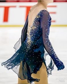 the figure skater is wearing an ice skating outfit