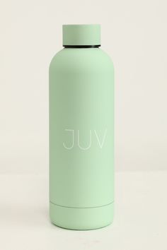 a light green water bottle with the word vuj written in white on it's side